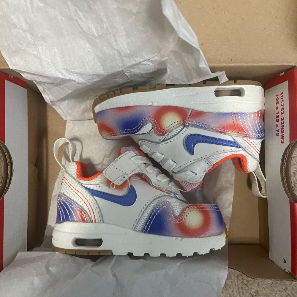 Nike Kids' White and Purple Sneakers with Orange Accents